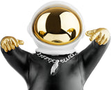 BRUBAKER Figurine Astronaut with Black Hoodie in Cool Pose - 8.3 Inch Spaceman Space Decor Figure with Chrome Plated Helmet and Silver Chain - Hand Painted - Gold, Black and White