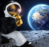 BRUBAKER Figurine Astronaut Singer with Golden Microphone and Black Hoodie - 6.7 Inch Spaceman Space Decor Figure with Chrome Plated Helmet - Hand Painted - Gold, Black and White