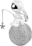 BRUBAKER Figurine Astronaut Sitting on The Moon Fishing for Stars - 6.7 Inch Spaceman Space Decor Figure with Fishing Rod and Chrome Plated Helmet - Hand Painted