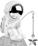 BRUBAKER Figurine Astronaut Sitting on The Moon Fishing for Stars - 6.7 Inch Spaceman Space Decor Figure with Fishing Rod and Chrome Plated Helmet - Hand Painted