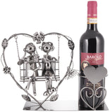 BRUBAKER Bottle Holder Wine - Heart with Couple on Swing - Romantic Metal Bottle Stand - Love Gift or Decoration Object - with Greeting Card