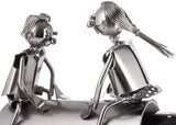BRUBAKER Bottle Holder Couple on a Seesaw - Metal Rocker with Bottle Stand - with Greeting Card