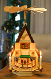 BRUBAKER Wooden Christmas Pyramid 19.3 Inches - Nativity Play - 4 Tier Carousel with 4 Golden Metal Candle Holders - Natural Wood - Hand Painted Figures