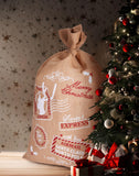 BRUBAKER Large Christmas Sack - Santa Express Stamps Gift Bag - 31.5 Inches Holiday Sack - Merry Christmas Design