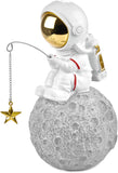 BRUBAKER Figurine Astronaut Sitting on The Moon Fishing for Stars - 6.7 Inch Spaceman Space Decor Figure with Fishing Rod and Chrome Plated Helmet - Hand Painted